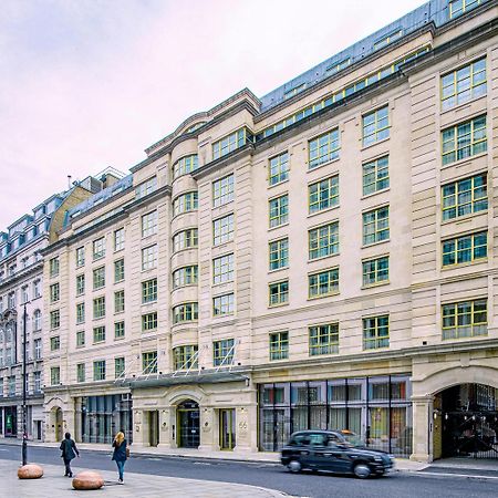 Middle Eight - Covent Garden - Preferred Hotels And Resorts London Luaran gambar The photo shows a large, multi-story building with a classical architectural style. The facade features a mix of light-colored stone and large windows, giving it a sophisticated appearance. The building has several levels with prominent horizontal li