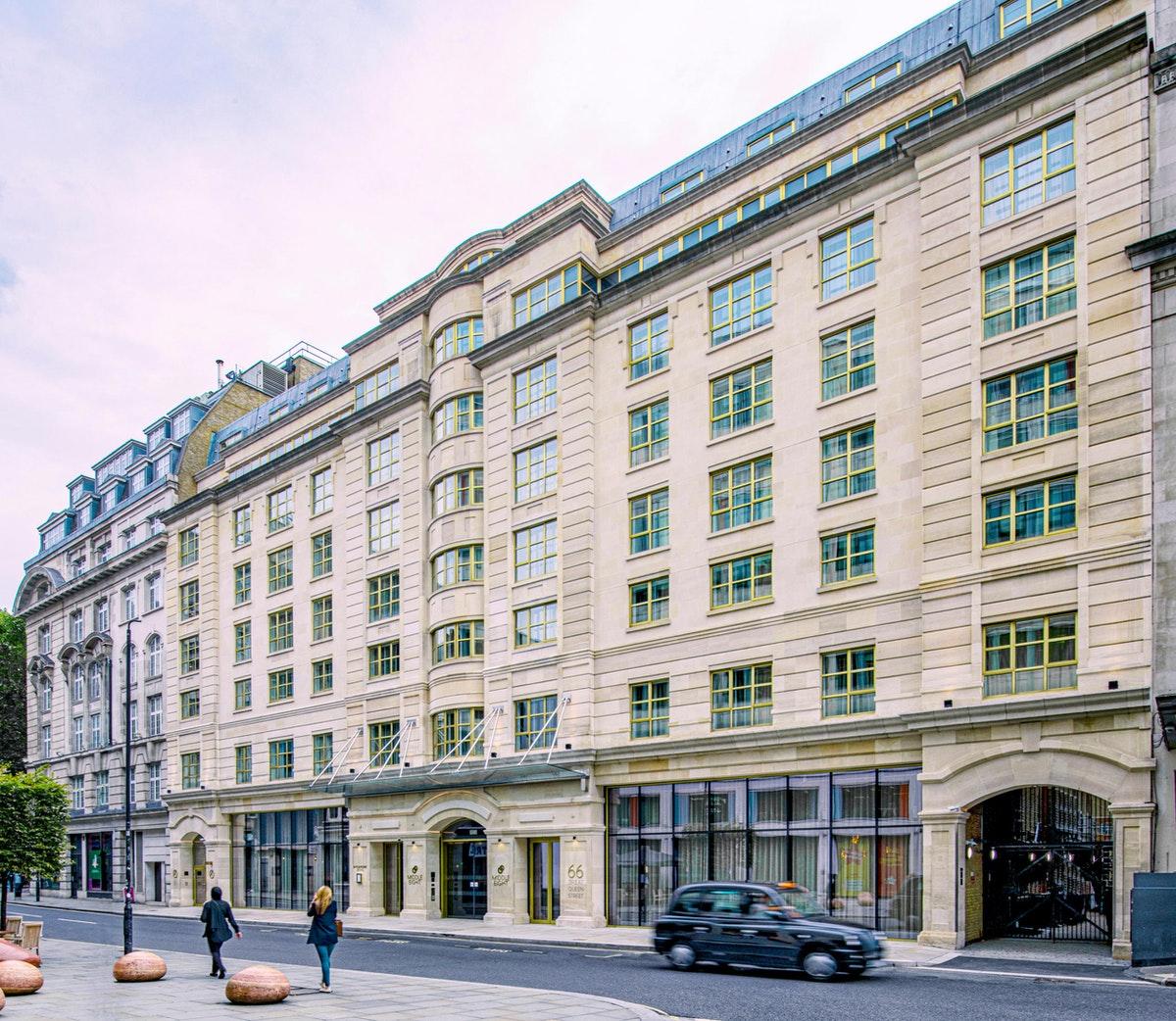 Middle Eight - Covent Garden - Preferred Hotels And Resorts London Luaran gambar The photo shows a large, multi-story building with a classical architectural style. The facade features a mix of light-colored stone and large windows, giving it a sophisticated appearance. The building has several levels with prominent horizontal li